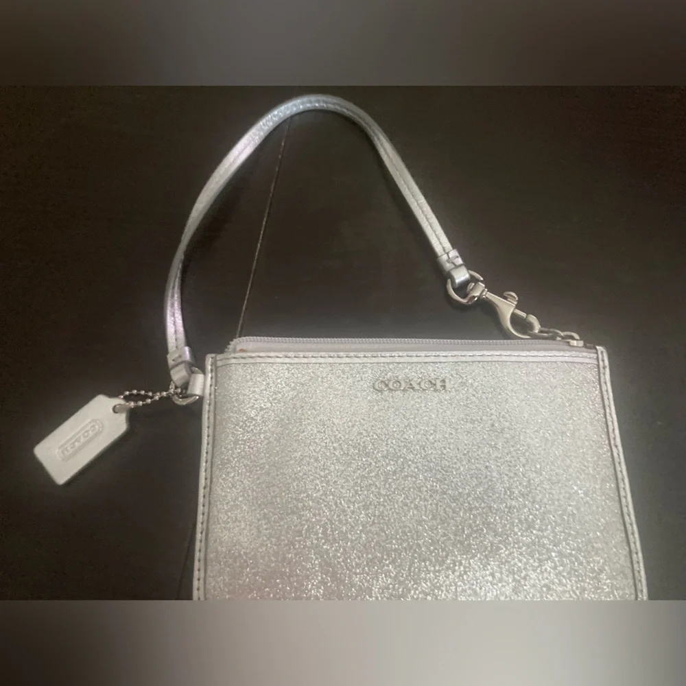 Coach Vintage glittery silver skinny zip wristlet wallet. Good used condition